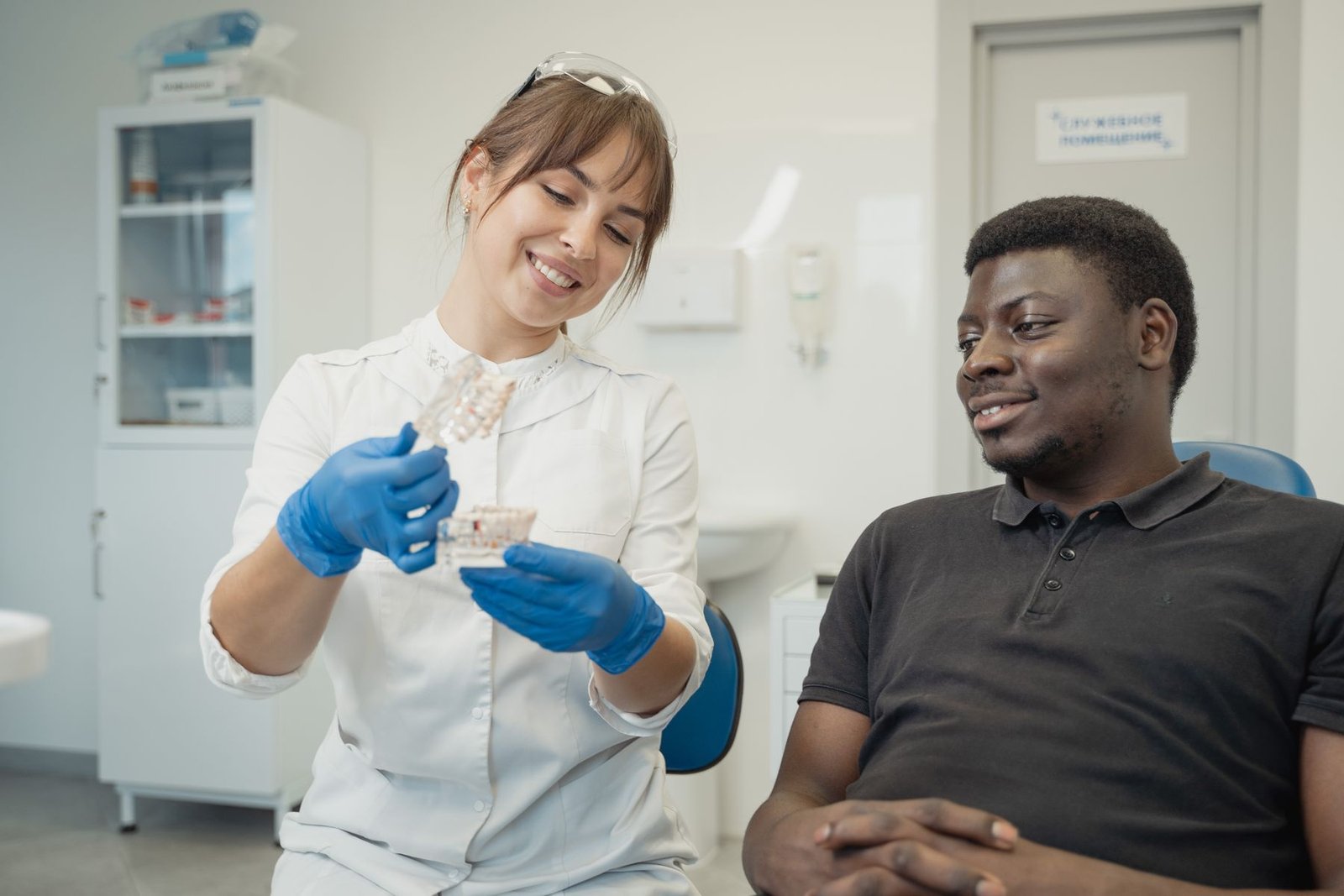 Dentist explaining a treatment model to a patient